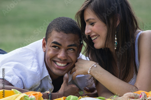 Young and smiling couple studying at the park photo