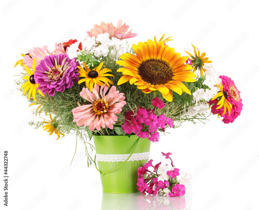 Beautiful bouquet of bright flowers in pail isolated on white