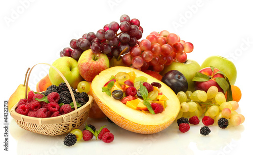 fresh fruits salad in melon  fruits and berries  isolated