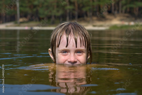 Fototapeta Naklejka Na Ścianę i Meble -  Children in water closeup