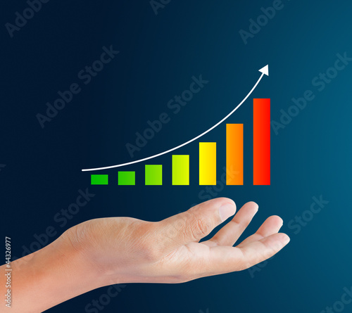 hand holding bar graph with rising arrow