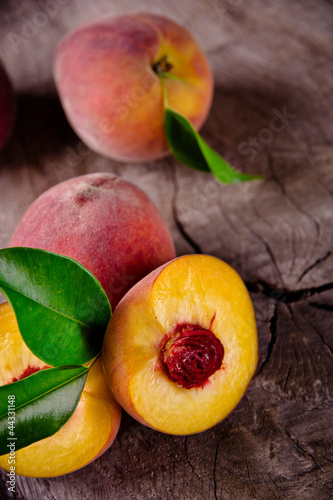 Fresh peaches on wooden table
