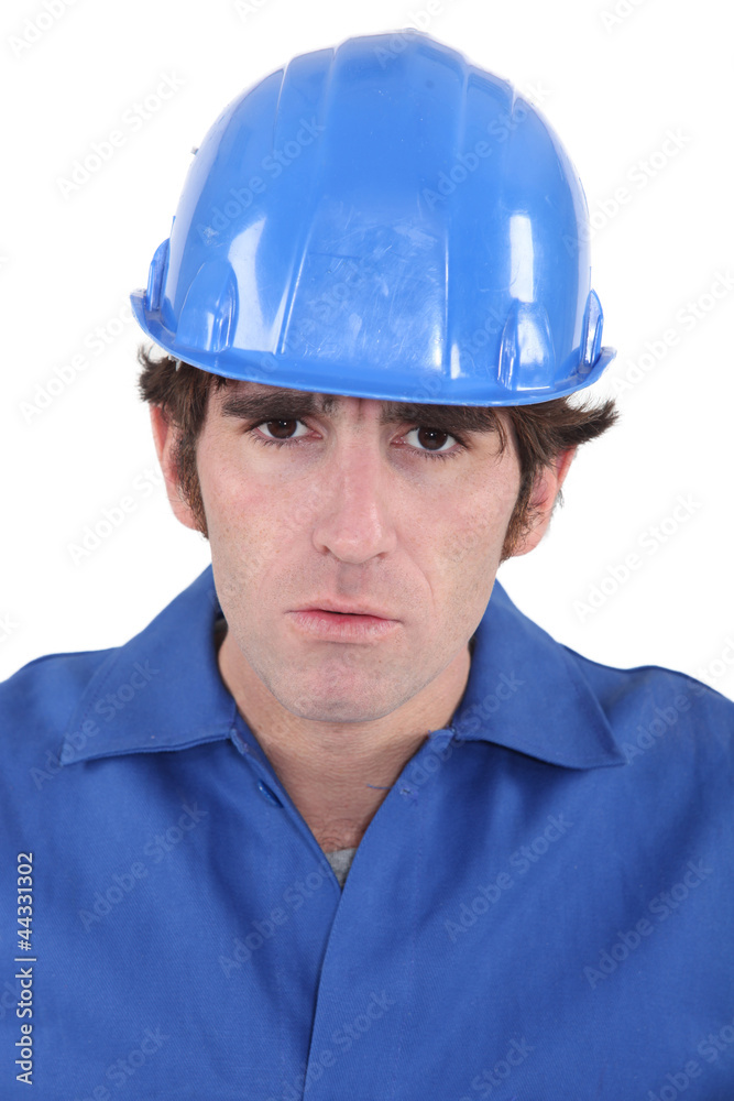 Portrait of a frowning construction worker Portrait of a frowning construction worker
