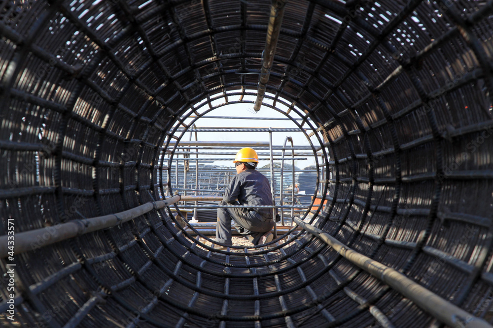 reinforced component at the construction site and workers