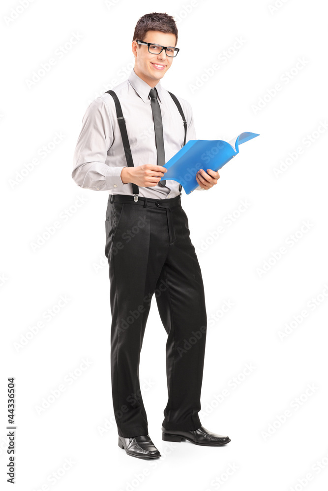 Professional young man holding a fascicule Professional young man holding a fascicule