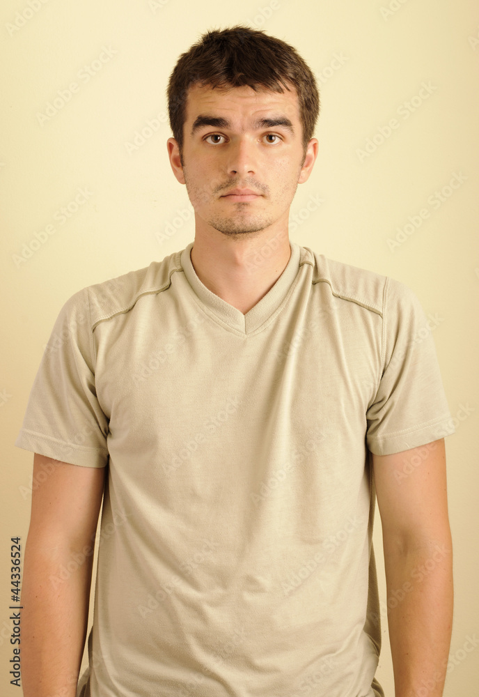 Baffled young man, funny expression Baffled young man, funny expression