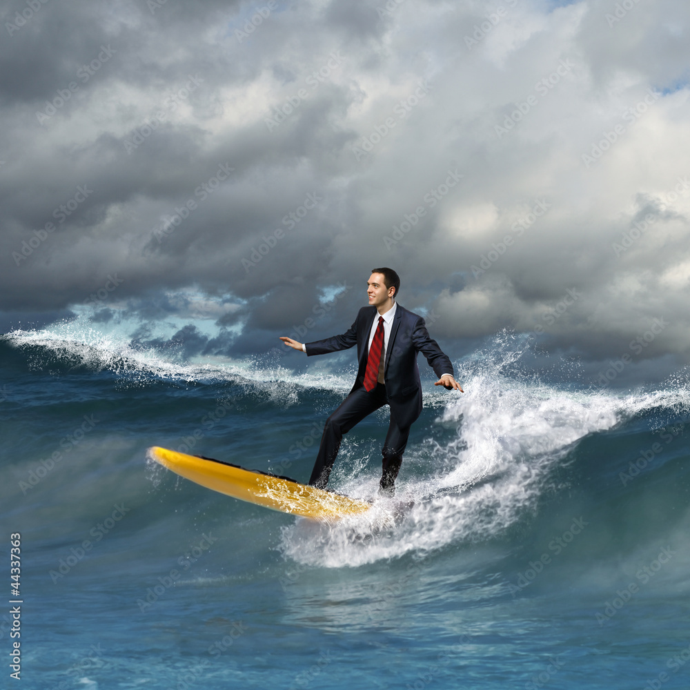 Young business person surfing on the waves Young business person surfing on the waves