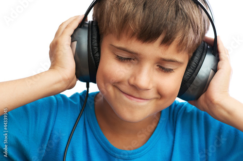 The boy is listening to music photo