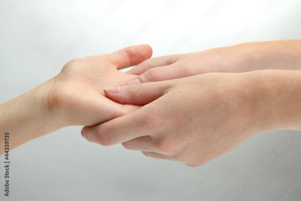Hand massage, on grey background