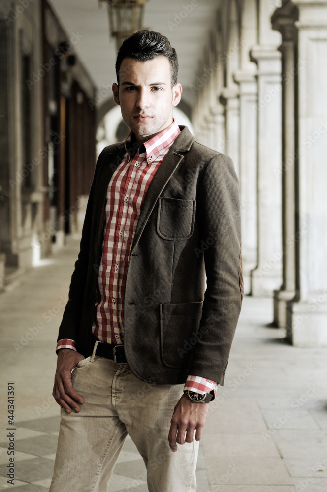 Young handsome man, model of fashion, wearing jacket and shirt