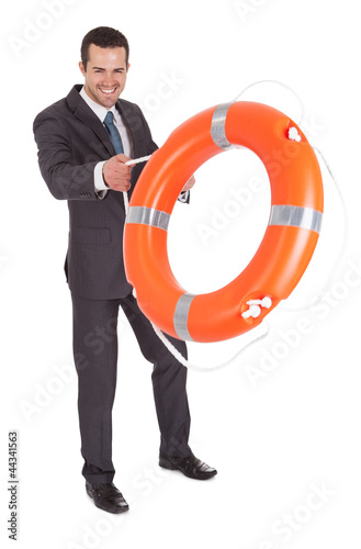 Young businessman with life buoy