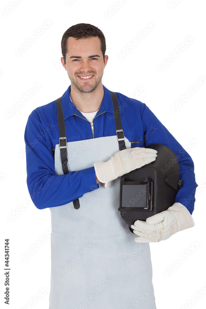 Portrait of confident young welder