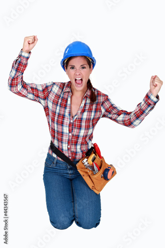 Fotografija Triumphant female construction worker