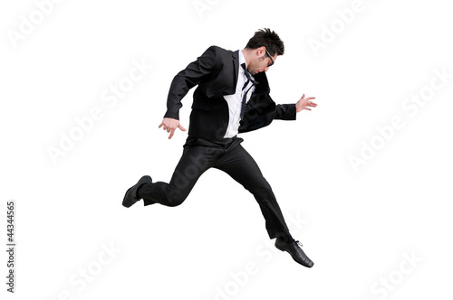 Young handsome businessman with eyeglasses jumping  isolated on
