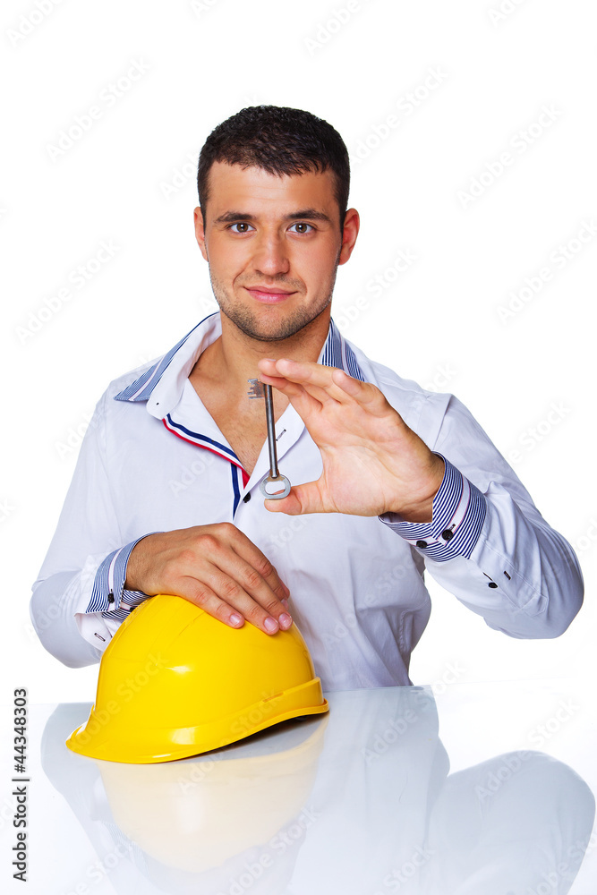 Portrait of sexy worker posing in studio with key Portrait of sexy worker posing in studio with key