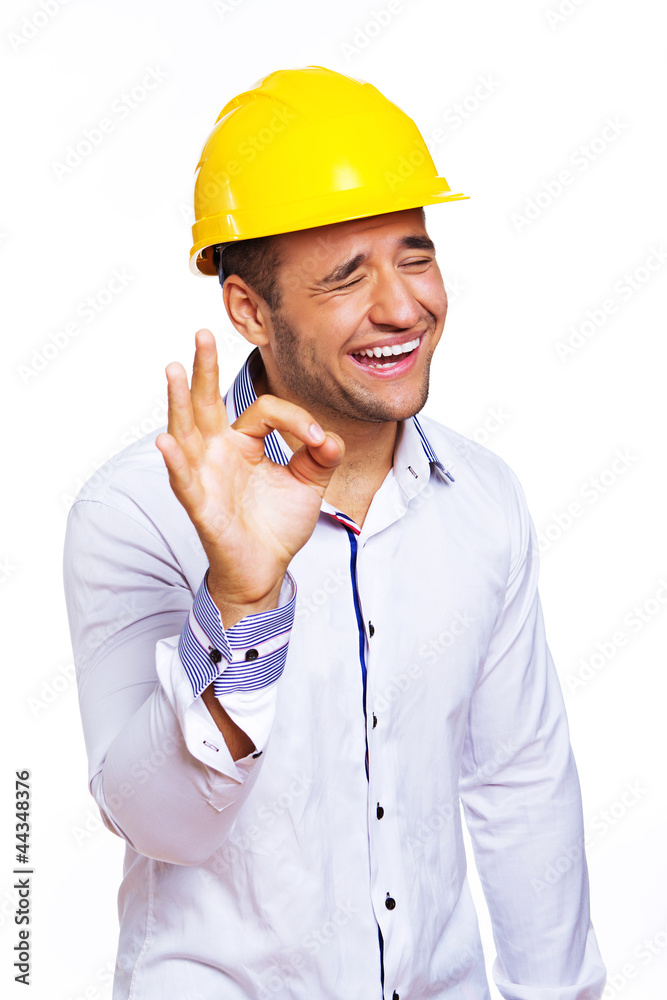 Portrait of sexy worker posing in studio in helmet