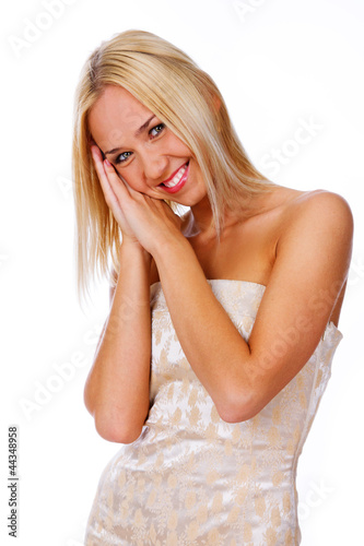 Portrait of sexy woman posing in studio in white dress