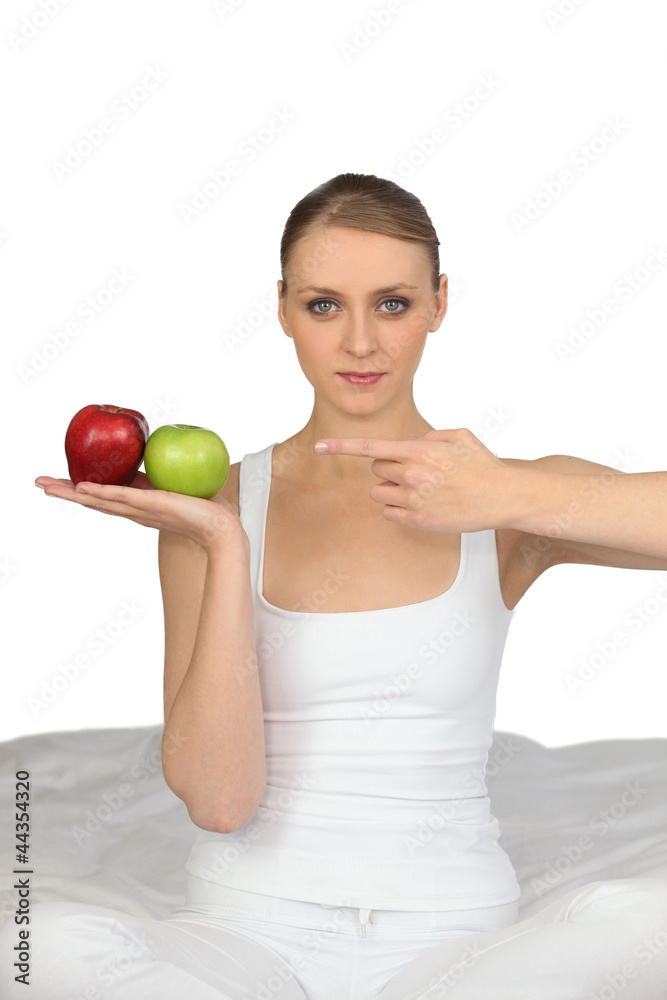 Woman pointing to apples Woman pointing to apples