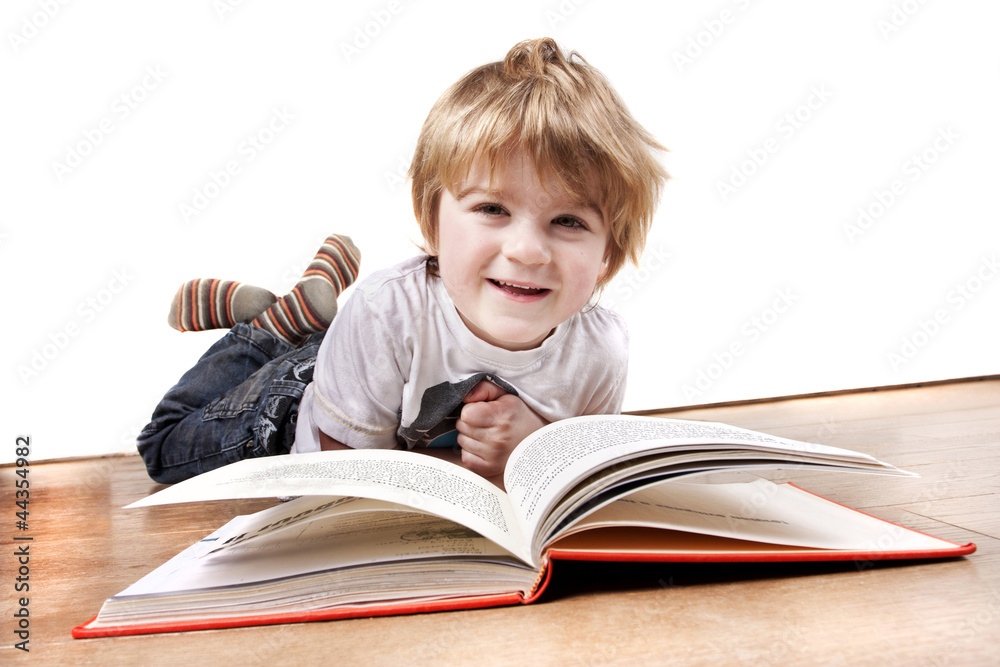 young 4 year old boy reading a book young 4 year old boy reading a book