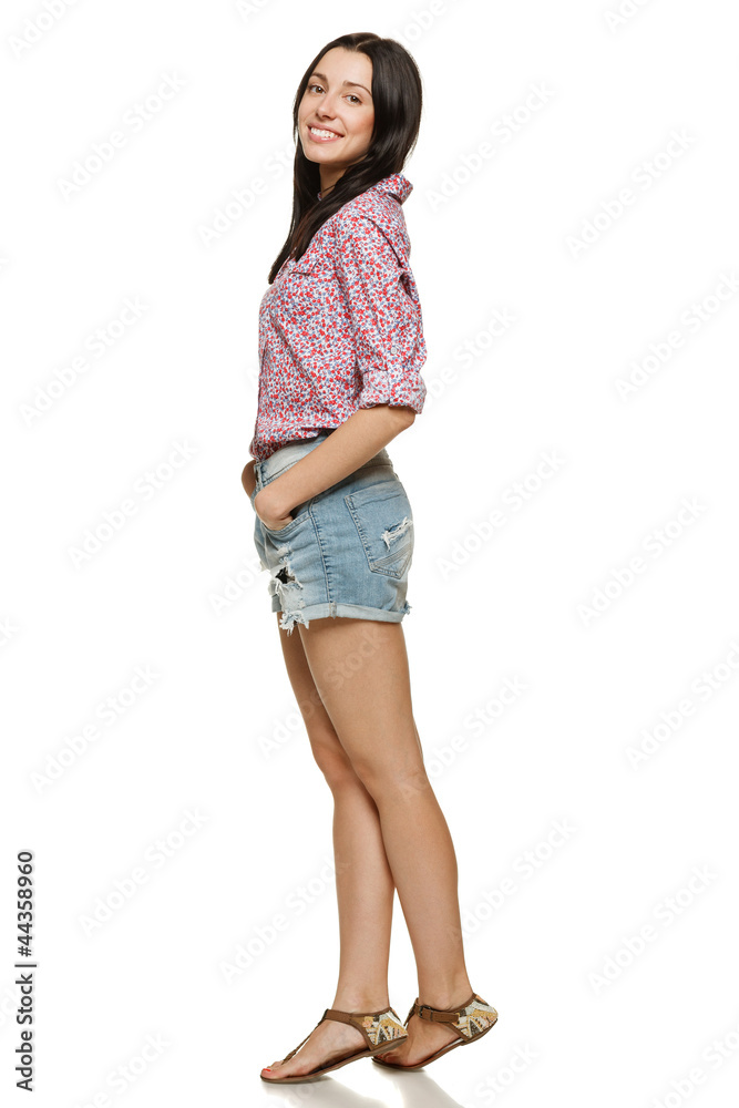 Full length of young female in shorts and floral shirt Full length of young female in shorts and floral shirt