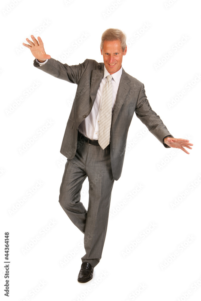 Balancing senior business man