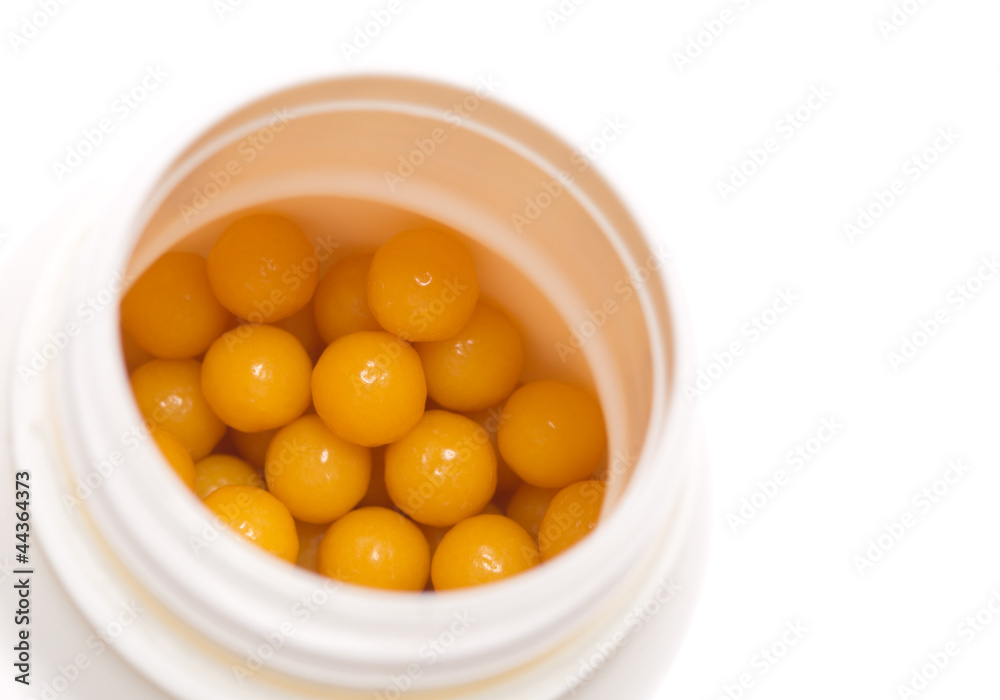 Yellow pills in open bottle Yellow pills in open bottle