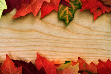 fall leafs over wooden board