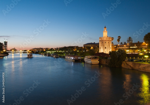 view of river Guadalquivir in Seville with Golden Tower (Torre d photo