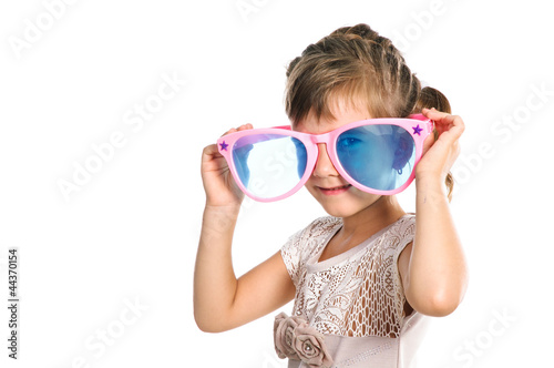 cute girl 5-6 years old wearing huge glasses isolated over white
