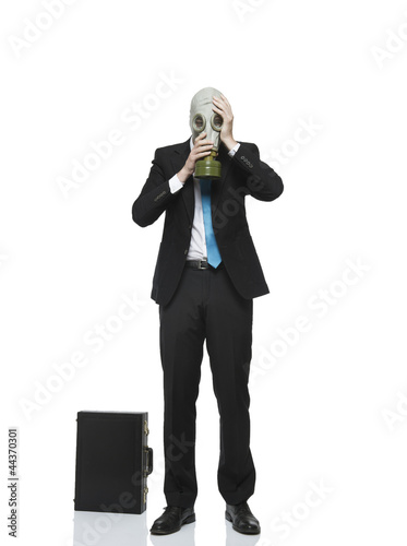 businessman mit gasmaske photo