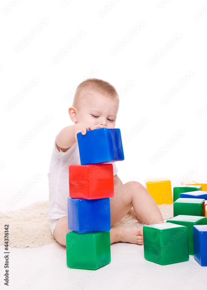 Baby boy plays with toy blocks Baby boy plays with toy blocks