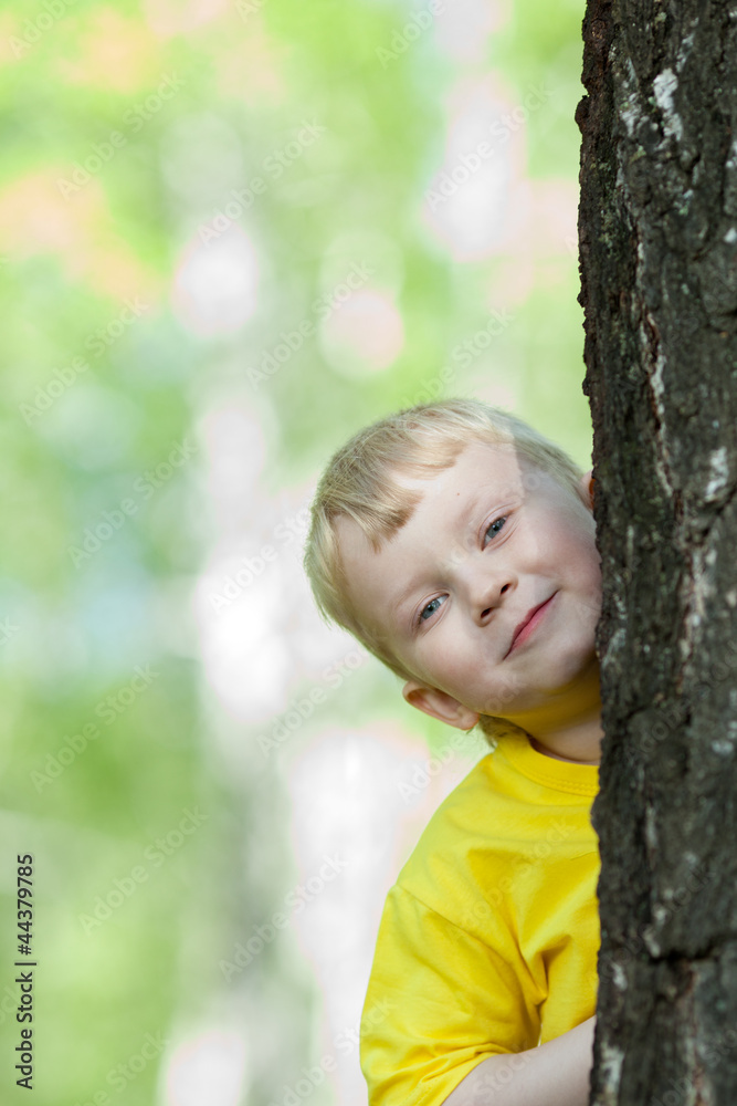kid playing on the park tree outdoor kid playing on the park tree outdoor