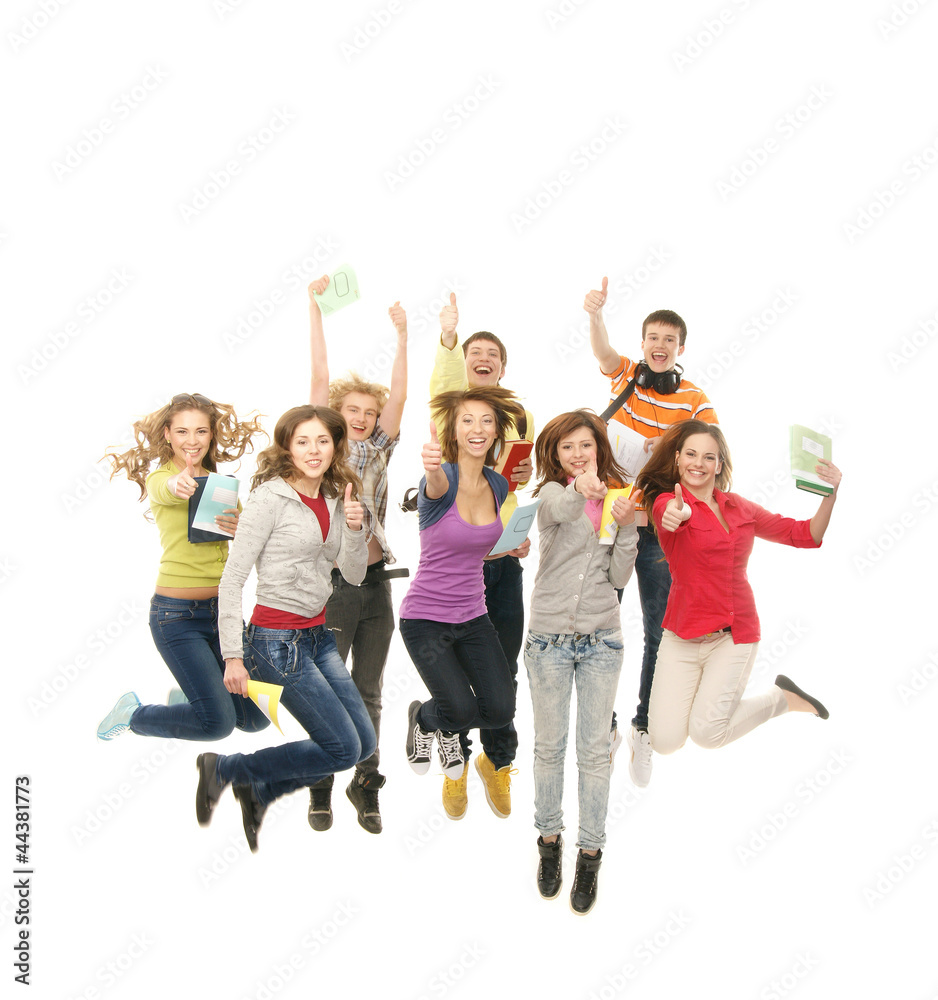 A group of young and happy teenagers jumping together A group of young and happy teenagers jumping together
