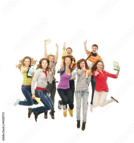 A group of young and happy teenagers jumping together