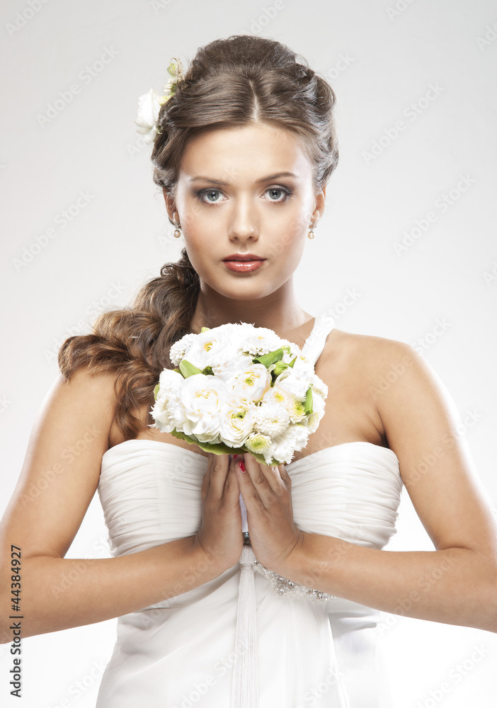 A young and attractive Caucasian bride in white clothes A young and attractive Caucasian bride in white clothes