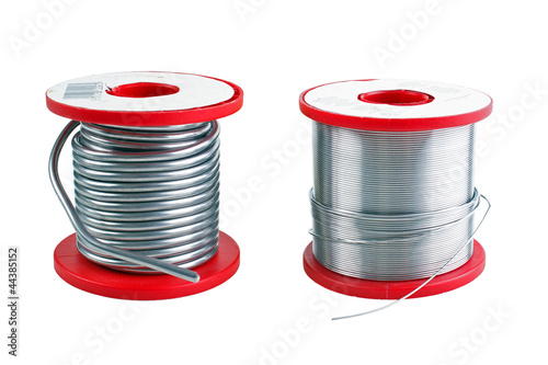 Two different size soldering tin spools photo