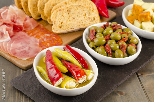 Tapas - Chilies, olives, cheese, lomo, chorizo & serrano ham