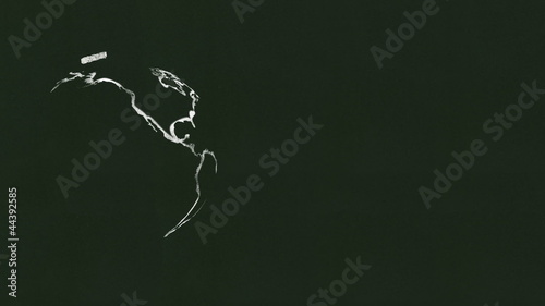 Rotating globe & the word Earth drawn on a chalkboard.