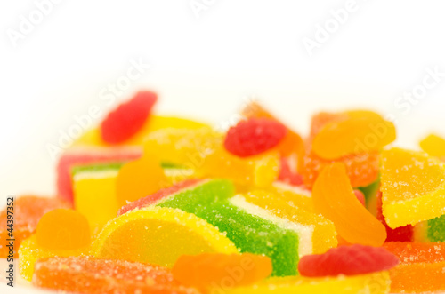 Tasty colorful jelly candies on a white background