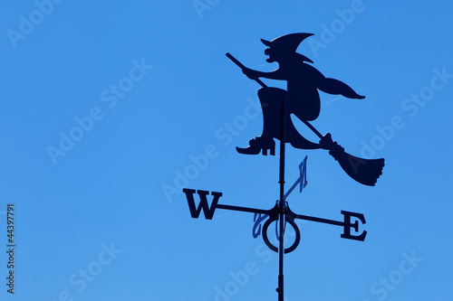 Witch on broomstick weather vane