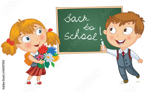 Boy wrote in chalk on blackboard. Girl holding a bouquet