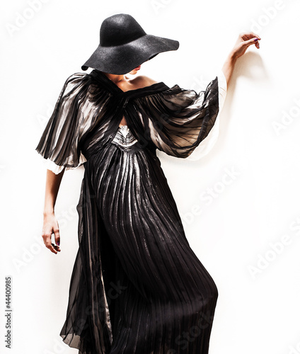 girl in black hat touching face and lips