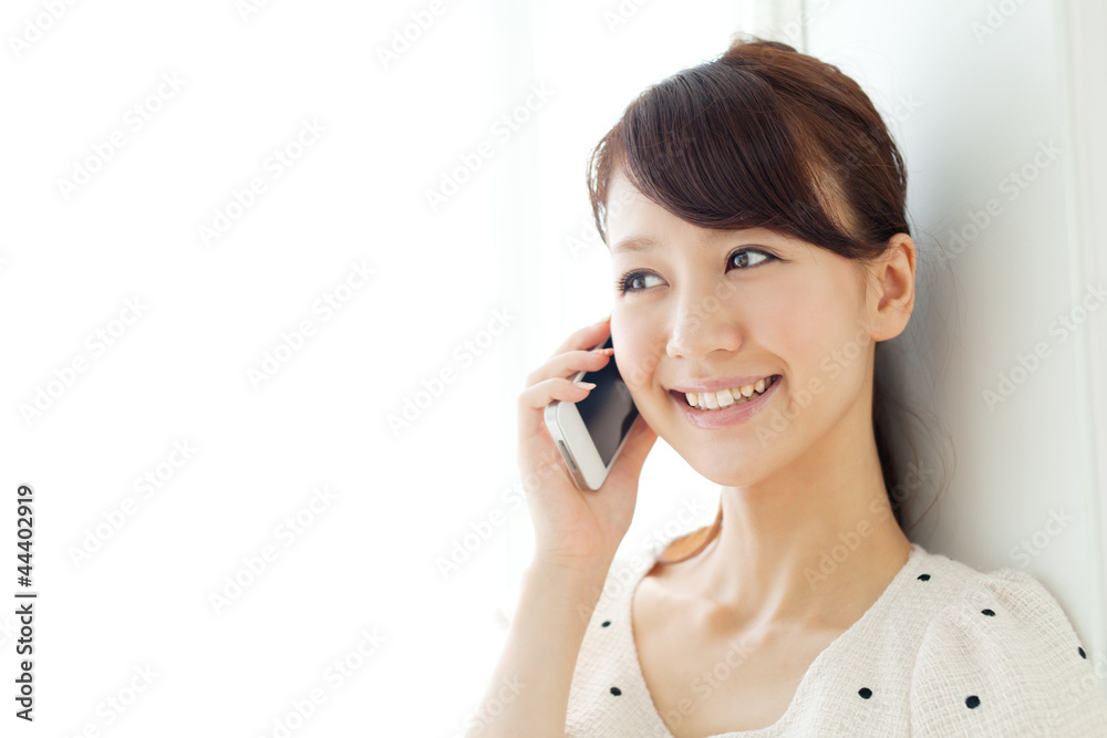 Beautiful young woman using a mobile phone. Portrait of asian. Beautiful young woman using a mobile phone. Portrait of asian.