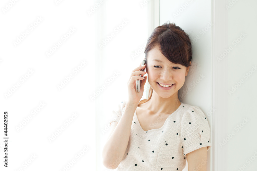 Beautiful young woman using a mobile phone. Portrait of asian. Beautiful young woman using a mobile phone. Portrait of asian.