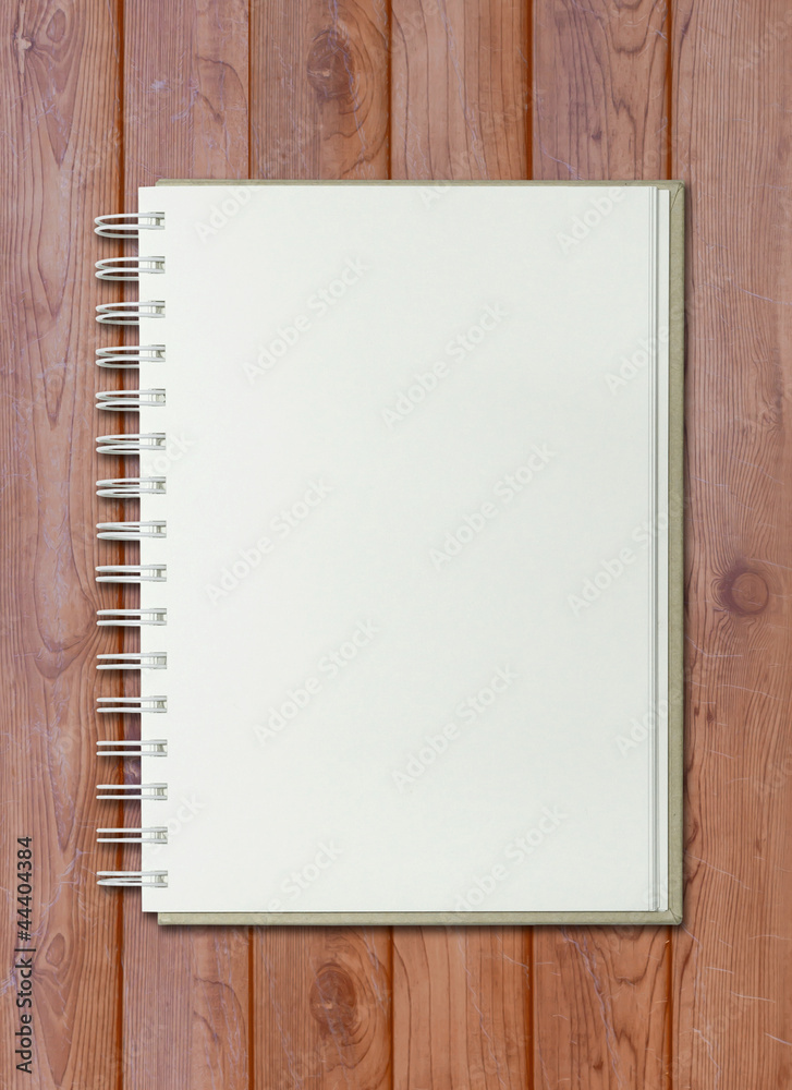 blank white notebook on wooden background blank white notebook on wooden background