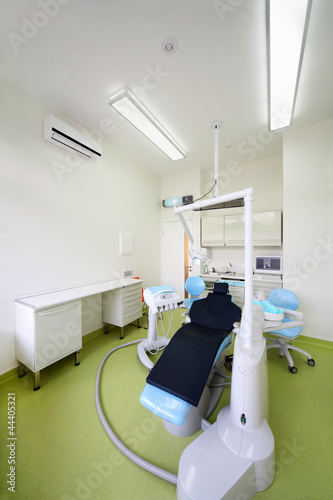 Empty dental clinic. Chair for patient and  drill for dentist