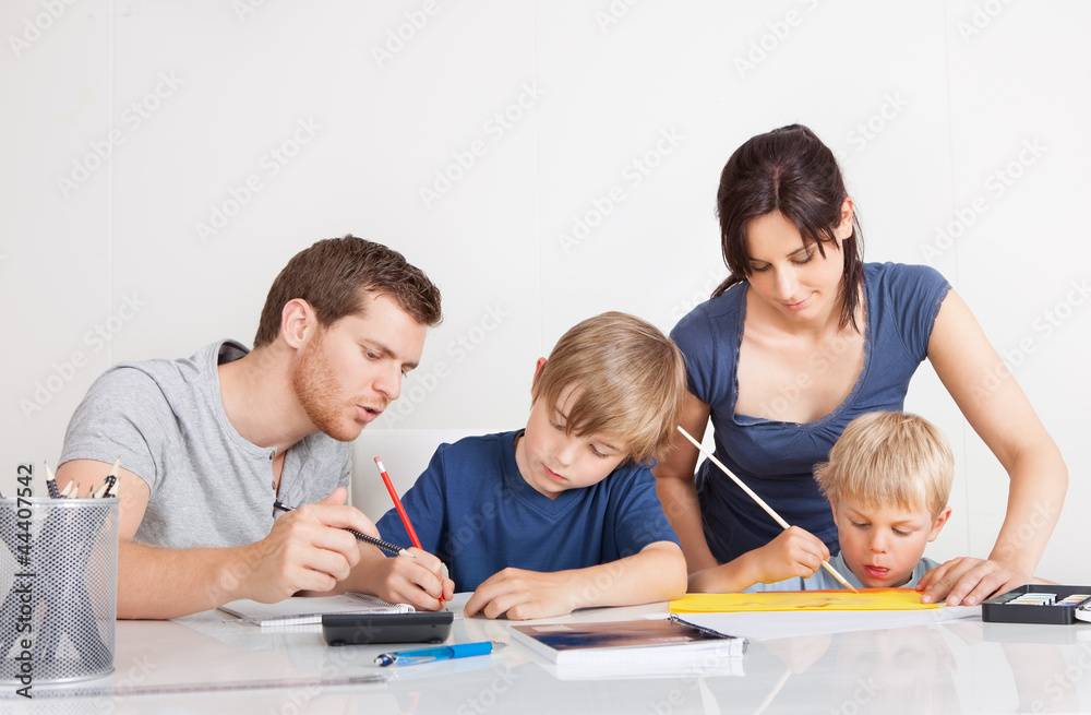 Parents helping their children with homework Parents helping their children with homework