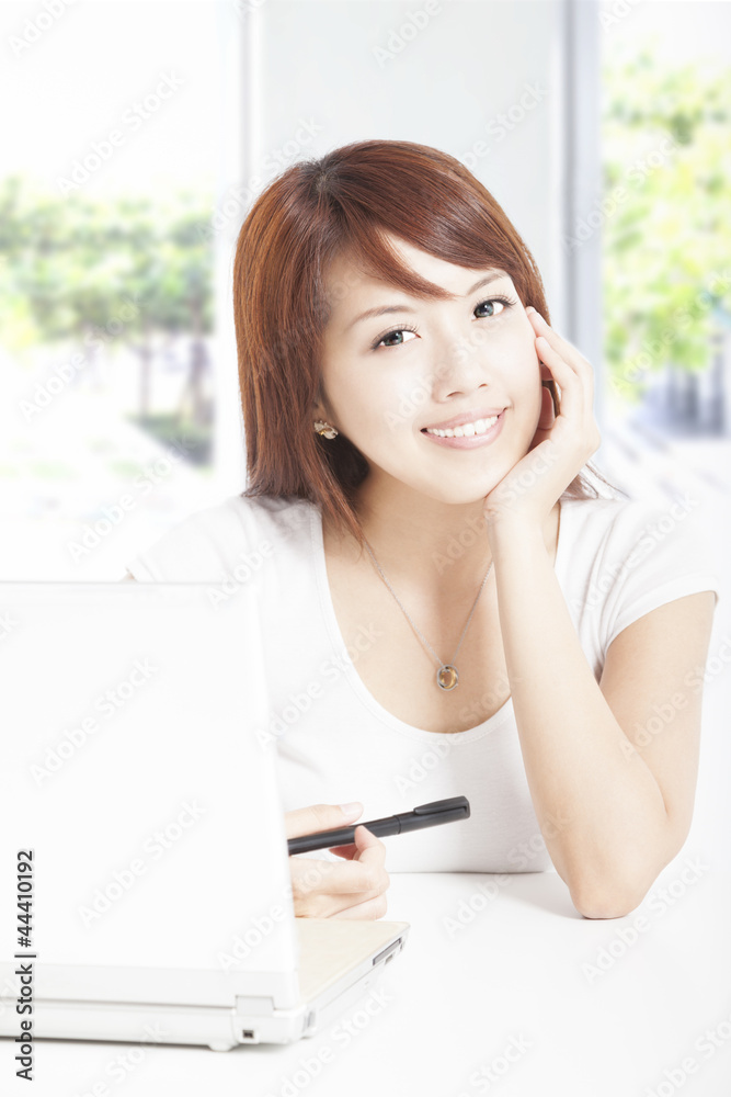 beautiful young woman with laptop in the office beautiful young woman with laptop in the office
