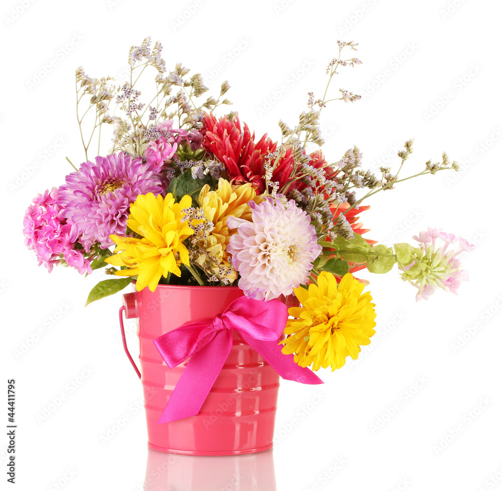 Bright pink bucket with flowers isolated on white