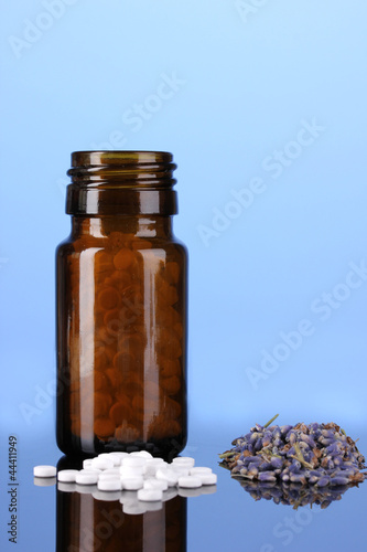 bottle with pills and herbs